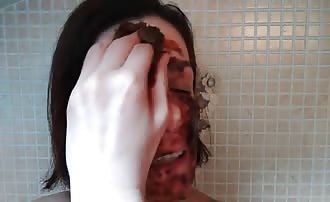Rubbing poop on her face