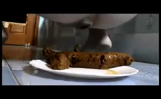 Brown turd on white plate