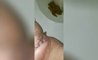 Shaved teen shits in close up